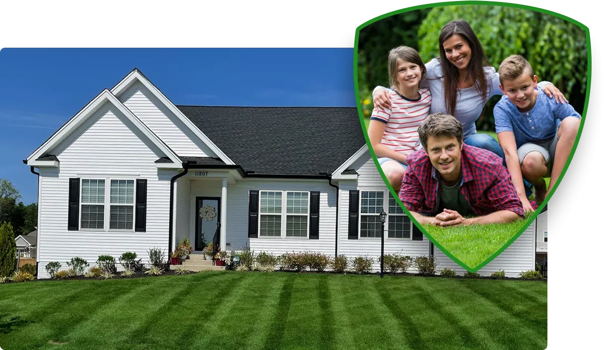 family laying on green grass